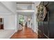 Bright foyer featuring hardwood floors, staircase, and an open view to other rooms at 1115 Ballington Dr, Cumming, GA 30041