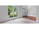 Open-concept living area with hardwood floors, large windows, and an airy feel at 1115 Ballington Dr, Cumming, GA 30041
