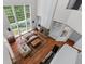 Two-story living room featuring a fireplace and large windows overlooking the backyard at 1115 Ballington Dr, Cumming, GA 30041