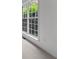 Bright and airy living room with a large window at 1115 Ballington Dr, Cumming, GA 30041