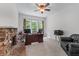 Office features a fireplace, neutral carpet, and plenty of natural light at 1115 Ballington Dr, Cumming, GA 30041