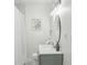 Stylish bathroom with modern vanity, elegant mirror, and decorative light fixtures for a spa-like experience at 2485 Hillside Ave, Decatur, GA 30032