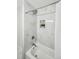 Nicely renovated bathroom area features white marble tiling, rainfall shower head, and built-in shelf at 2485 Hillside Ave, Decatur, GA 30032