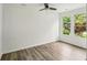 Bright bedroom with ample natural light from the window, modern flooring, and neutral walls at 2485 Hillside Ave, Decatur, GA 30032