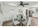 Elegant dining area with a modern table, chairs, and lighting, adjacent to a renovated kitchen at 2485 Hillside Ave, Decatur, GA 30032
