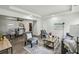 Open-concept living room with hardwood floors, a dining area, and a bright, airy feel at 2485 Hillside Ave, Decatur, GA 30032
