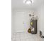 Functional utility room with tile flooring, water heater, and ample space for storage at 2485 Hillside Ave, Decatur, GA 30032