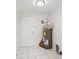 Functional utility room features tile flooring, water heater, and access door at 2485 Hillside Ave, Decatur, GA 30032
