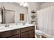 Bathroom featuring a double sink vanity, toilet, and a shower curtain at 2525 Well Springs Dr, Buford, GA 30519
