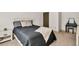 Bedroom featuring a bed with neutral colored walls, carpet flooring, and a dresser at 2525 Well Springs Dr, Buford, GA 30519