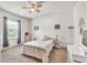 Bedroom featuring neutral decor, carpet flooring, and a window at 2525 Well Springs Dr, Buford, GA 30519