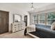 Bright bedroom with a decorative chandelier, a dresser, and carpet flooring at 2525 Well Springs Dr, Buford, GA 30519
