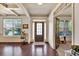 Elegant entryway with hardwood floors, decorative trim, natural light, and view of an office at 2525 Well Springs Dr, Buford, GA 30519