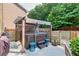 Backyard hot tub under a pergola with privacy screening and landscaping, creating a tranquil outdoor escape at 2525 Well Springs Dr, Buford, GA 30519