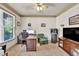 Cozy office space featuring a window, natural lighting and TV at 2525 Well Springs Dr, Buford, GA 30519