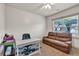 Office with a desk, a brown leather couch, neutral walls, and carpet flooring at 2525 Well Springs Dr, Buford, GA 30519