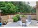Patio with seating area and landscaping, perfect for enjoying the outdoors in privacy at 2525 Well Springs Dr, Buford, GA 30519