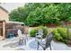 Relaxing backyard patio featuring a hot tub under a pergola, comfortable seating and landscaping for privacy at 2525 Well Springs Dr, Buford, GA 30519