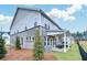 Spacious backyard with covered patio, lush greenery, and exterior view of the home at 5769 Tillman Way, Powder Springs, GA 30127