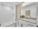Modern bathroom with white cabinets, hexagon tiled shower, and marble countertop at 5769 Tillman Way, Powder Springs, GA 30127