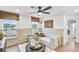 Cozy bonus room with a comfortable sectional, wood-paneled walls, and natural light, creating a relaxing retreat at 5769 Tillman Way, Powder Springs, GA 30127