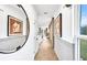 Bright hallway with modern decor, wood floors, and natural light, creating an inviting entryway at 5769 Tillman Way, Powder Springs, GA 30127