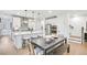 Modern kitchen featuring a central island with seating, sleek appliances, and plenty of counter space at 5769 Tillman Way, Powder Springs, GA 30127