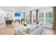 Elegant living room with fireplace, neutral tones, and large windows, offering a comfortable and stylish space at 5769 Tillman Way, Powder Springs, GA 30127