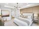 Serene bedroom with a plush bed, tray ceilings, and soft lighting, providing a peaceful sanctuary at 5769 Tillman Way, Powder Springs, GA 30127