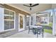 Cozy patio with brick columns, ceiling fan, and comfortable seating area at 5769 Tillman Way, Powder Springs, GA 30127