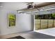 Open garage with white walls and view of wooden fence outside at 888 Old Tucker Rd, Stone Mountain, GA 30087