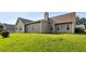 Picture of the backyard featuring well maintained lawn and the back of the house at 99 Rainwater Ln, Dallas, GA 30157
