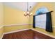 Dining room featuring hardwood floors, neutral paint, crown molding, and ample natural light at 99 Rainwater Ln, Dallas, GA 30157
