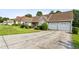 View of the front exterior featuring a spacious driveway leading to a two-car attached garage at 99 Rainwater Ln, Dallas, GA 30157