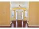 Entryway with beautiful hardwood flooring, neutral walls and trim detail leading to the home's interior at 99 Rainwater Ln, Dallas, GA 30157