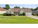 Charming single-story home with well-manicured lawn, mature landscaping, and a two-car garage at 99 Rainwater Ln, Dallas, GA 30157