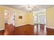 Living room with hardwood floors, neutral walls and views into the front entryway and dining room at 99 Rainwater Ln, Dallas, GA 30157
