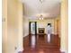 Living room featuring hardwood floors, fireplace, neutral paint, and views to other rooms at 99 Rainwater Ln, Dallas, GA 30157