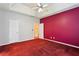 Spacious primary bedroom features a tray ceiling with fan and plush carpet flooring at 99 Rainwater Ln, Dallas, GA 30157