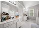 The bathroom features double vanities, tiled floors, and a soaking tub at 1205 Compass Pointe Xing, Alpharetta, GA 30005