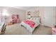 Bright and cozy bedroom featuring pink accents, floral patterns, and themed decor at 1205 Compass Pointe Xing, Alpharetta, GA 30005