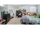 Cozy bedroom with a variety of decor and furnishings, including a bed, desk, and dresser at 1205 Compass Pointe Xing, Alpharetta, GA 30005