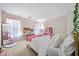 Charming pink themed bedroom with unique decor and ample natural light at 1205 Compass Pointe Xing, Alpharetta, GA 30005