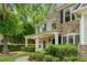 Beautiful home exterior with a covered porch and lush landscaping creates a welcoming atmosphere at 1205 Compass Pointe Xing, Alpharetta, GA 30005