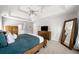 The spacious main bedroom includes a tray ceiling, multiple windows and nice furnishings at 1205 Compass Pointe Xing, Alpharetta, GA 30005