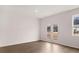 Spacious living room with hardwood floors and French doors leading to a backyard area at 1309 Aura Ln, Lawrenceville, GA 30045