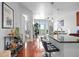 Open-concept kitchen features sleek black countertops, a breakfast bar with stools, and stainless steel appliances at 711 Cosmopolitan Ne Dr # 625, Atlanta, GA 30324