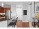 Open concept kitchen with breakfast bar and stainless appliances adjacent to the front door at 711 Cosmopolitan Ne Dr # 625, Atlanta, GA 30324
