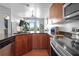 This kitchen boasts granite countertops, modern stainless steel appliances, and ample wood cabinetry at 711 Cosmopolitan Ne Dr # 625, Atlanta, GA 30324