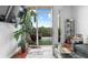 Bright living room with balcony access offers views of the wooded area at 711 Cosmopolitan Ne Dr # 625, Atlanta, GA 30324